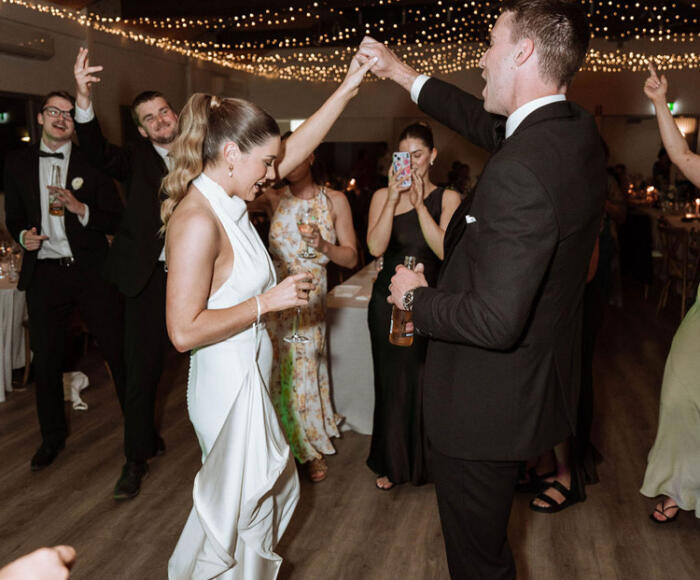 Bride and grooms first dance under fairy lights at Terindah Estate wedding reception